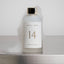 NOLES 14 Laundry Perfume Flasche auf Waschmaschine mit Schaum drumrum