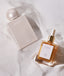 Fari Islands Eau de Parfum und Fai Islands Body Oil im Sand liegend
