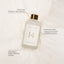 NOLES 14 Laundry Perfume Flasche auf einer weichen Decke mit Beschriftung der Duftnoten